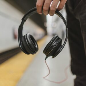 Wireless ANC Headphones with modern designin a subway station.